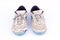 Old worn out futsal sports shoes on white background isolated