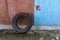 An old worn out tyre leaning against a wall in a poor neighbourhood suburb in Sofia, Bulgaria, Eastern Europe