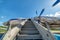 Old, worn passenger gangway. Gangway attached to the aircraft