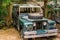 Old wrecked jeep that is being used as kid toy, decorative vintage objects