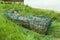 Old wrecked rowing boat in the grass