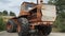 Old wrecked tractor used during liquidation of aftermath of the chernobyl disaster in Ukraine. Rusted abandoned