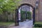 Old Wrought Iron Gate and Shops in Bruges Belgium