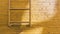Old yellow alley ladder brick wall background texture