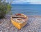 Old yellow boat on Nikolaiika Beach and the Corinthian Gulf, Greece