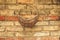 Old yellow brick wall background with basket