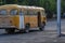 Old yellow bus on street of Bishkek.