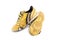 Old yellow futsal sports shoes and the insole is damaged  on white background football sportware object isolated