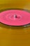 Old yellow orange colored vinyl record. background