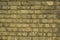 Old, yellow real stone brick wall texture, brick wall background