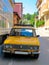 Old Yellow Soviet Lada car parked on Macedonian Street