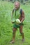 Olde aged Pacific Islander man carry a watermelon on eco tourism