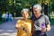 Older active couple outdoors with modern tech