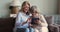 Older age daughter teach senior adult mother to use touchpad