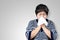 Older asian woman is having flu and sneezing from sickness seasonal virus problem