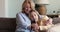 Older blond woman her young adult daughter using smartphone