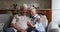 Older couple have fun using modern smart phone