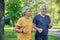 Older couple jogging in the summer park