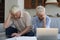Older couple looks concerned after family finances analysis
