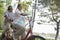 Older couple riding tandem bicycle, Beijing