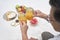 Older couple toasting with fresh orange juice while enjoying a breakfast picnic