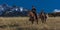 Older Cowboy leads packhorse across historic Last Dollar Ranch o