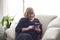 Older grandmother enjoys a relaxed smartphone at home