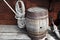 Older intricate marine ropes and old wooden barrel on deck of a ship