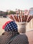 Older lady selling candied fruit on a stick on a beach