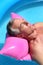 Older man sunbathing on a lilo