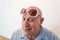 Older man with vintage womens sunglasses, bald, alopecia, chemotherapy, cancer, on white