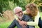 Older man and woman smiling outdoors