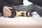 Older man working at home on kit of three wooden drawers on wheels