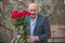 Older men with bouquet of roses, lifestyle of old men