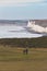 Older people couple walk through Seven Sisters Cliffs in England