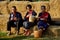 Older Phu Tai people sit and eat breakfast at stack rice straw i