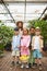 Older sister with younger brother and sisters on excursion in the garden