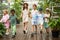 Older sister with younger brother and sisters on excursion in the garden