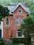 Older urban brick three story townhouse