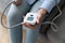 Older woman checking blood pressure with electronic tonometer, close up