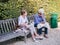 Older woman companions chat on a bench in a Paris park