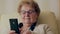 Older woman and her new smartphone.