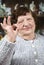 Older woman showing okay hand sign