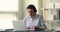 Older woman teacher lead online class by app on laptop