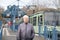 older woman and tram stop