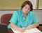 Older woman working at her desk