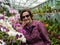 Older Women Gardener with Orchids