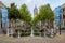 The oldest canal in Delft, Netherlands, with a view of the leaning tower of the Oude Kerk.