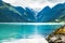 Oldevatnet lake in and view of Briksdal glacier in Norway