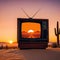 An oldschool style TV displaying a picturesque desert landscape at with cozy orange